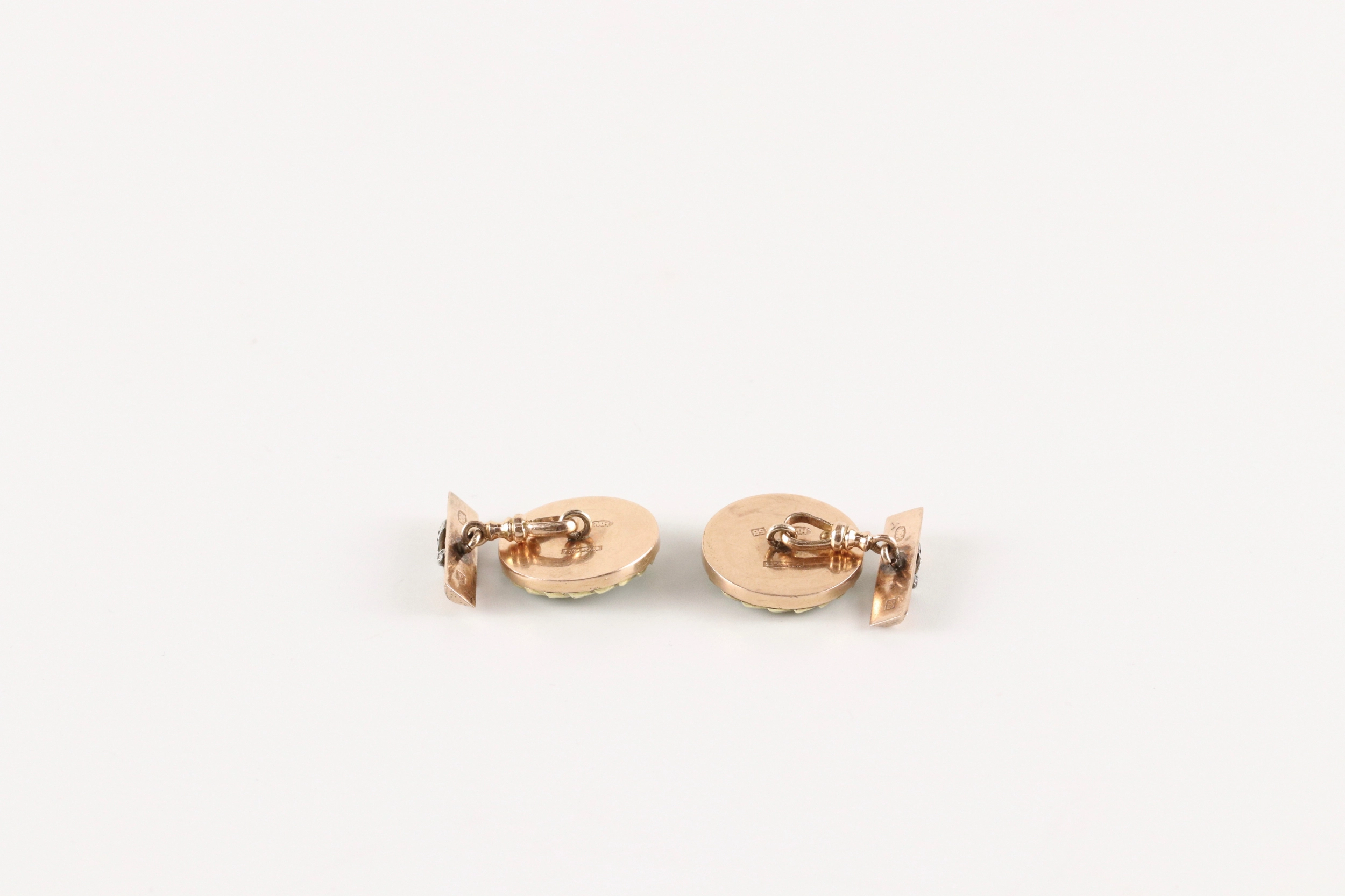 A pair of gold cufflinks