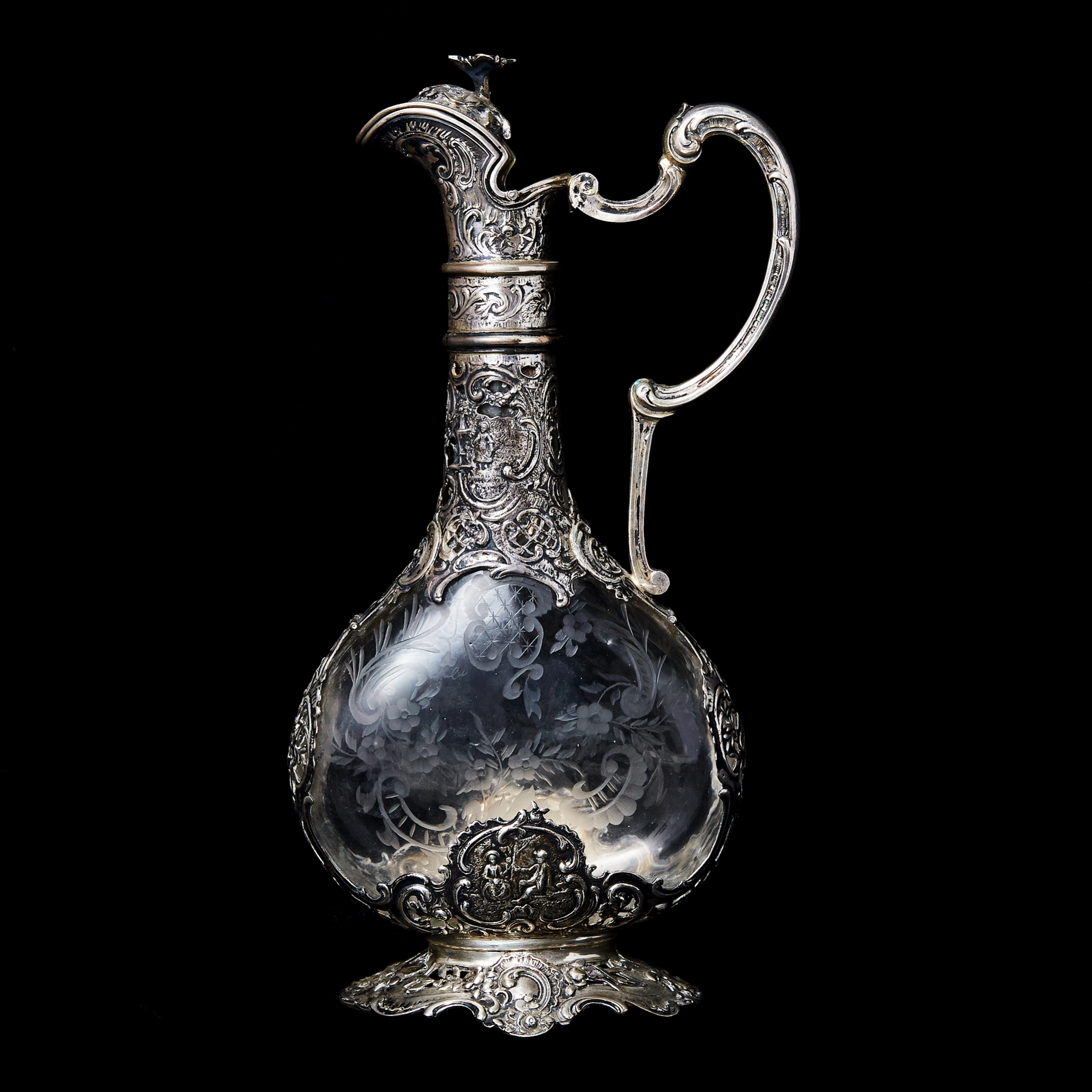 Silver decanter with glass.