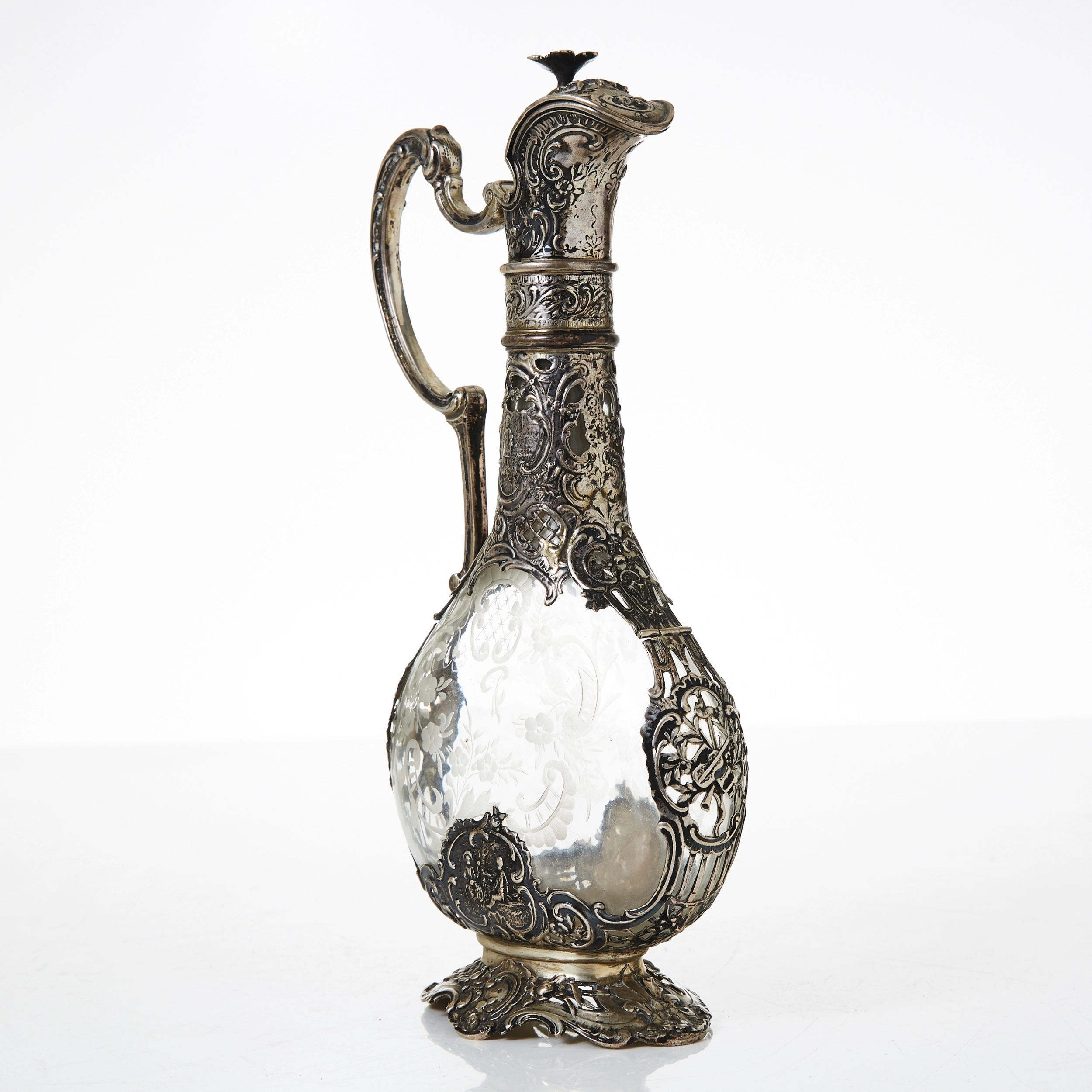 Silver decanter with glass.