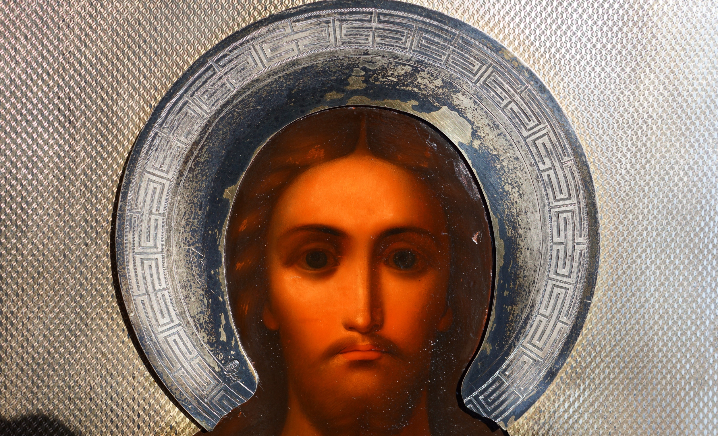 An ancient image of the Savior in an exquisite silver setting with enamel. Russia, Moscow, 1890. 
