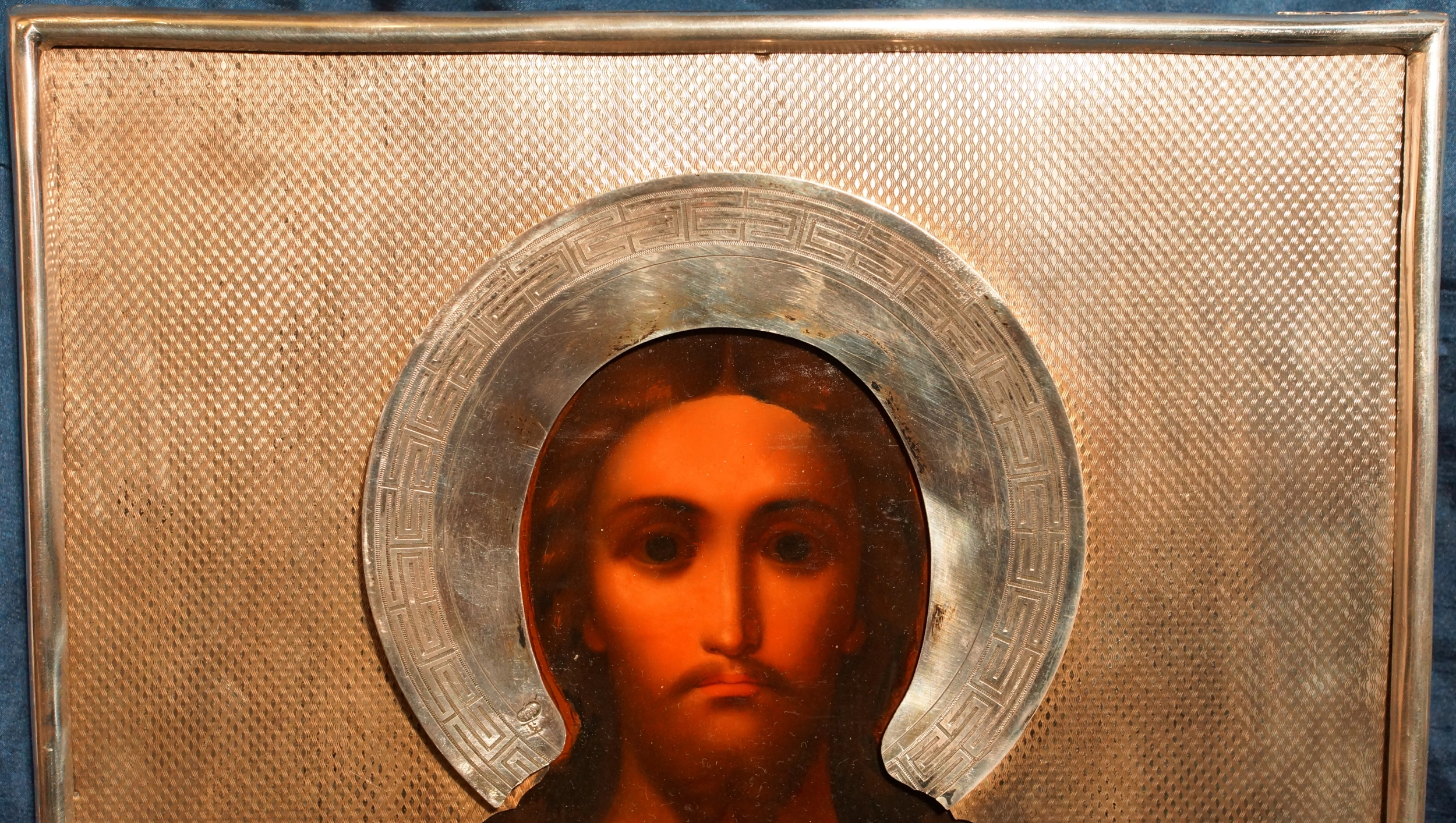 An ancient image of the Savior in an exquisite silver setting with enamel. Russia, Moscow, 1890. 