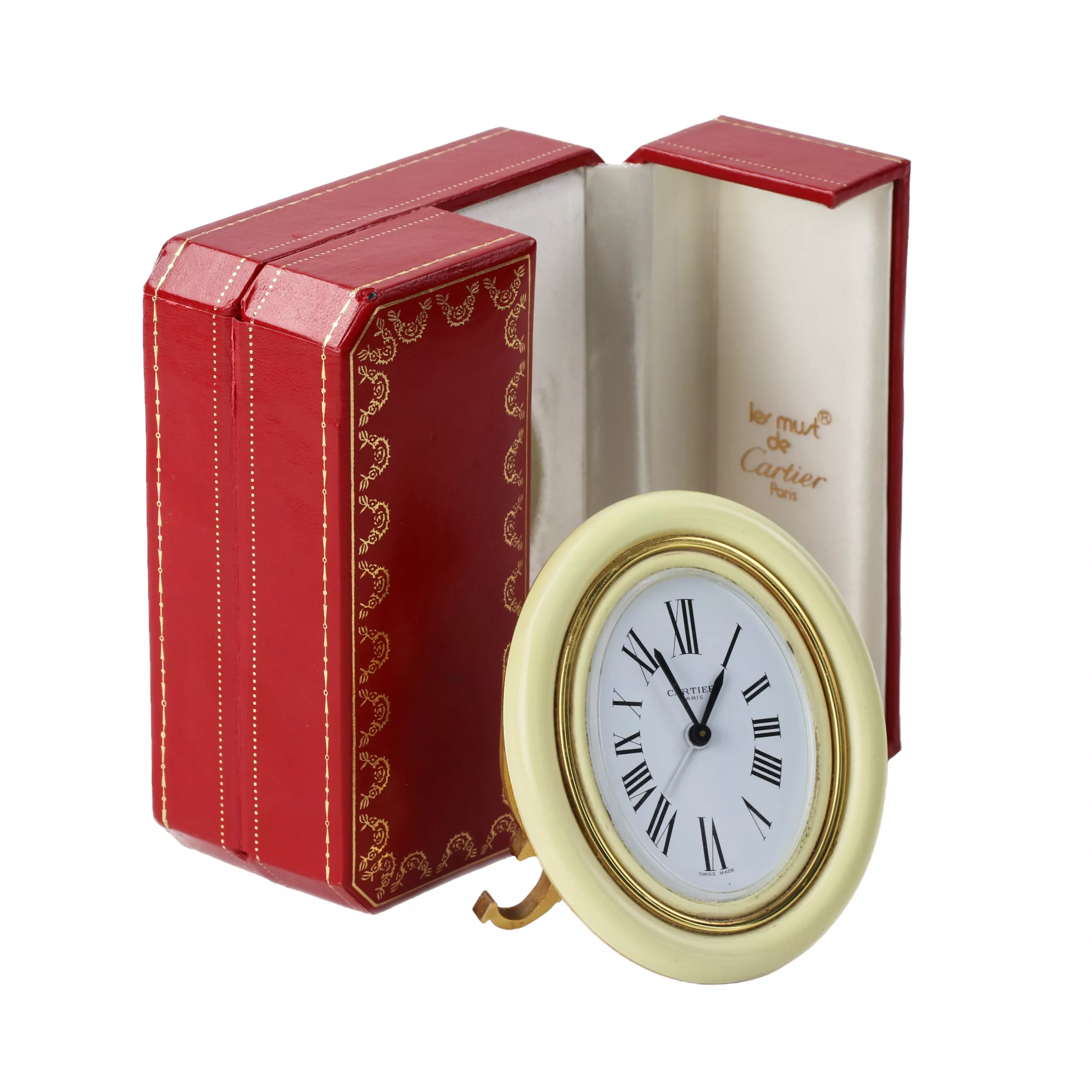 CARTIER. Reveil de voyage en metal dore avec email. 