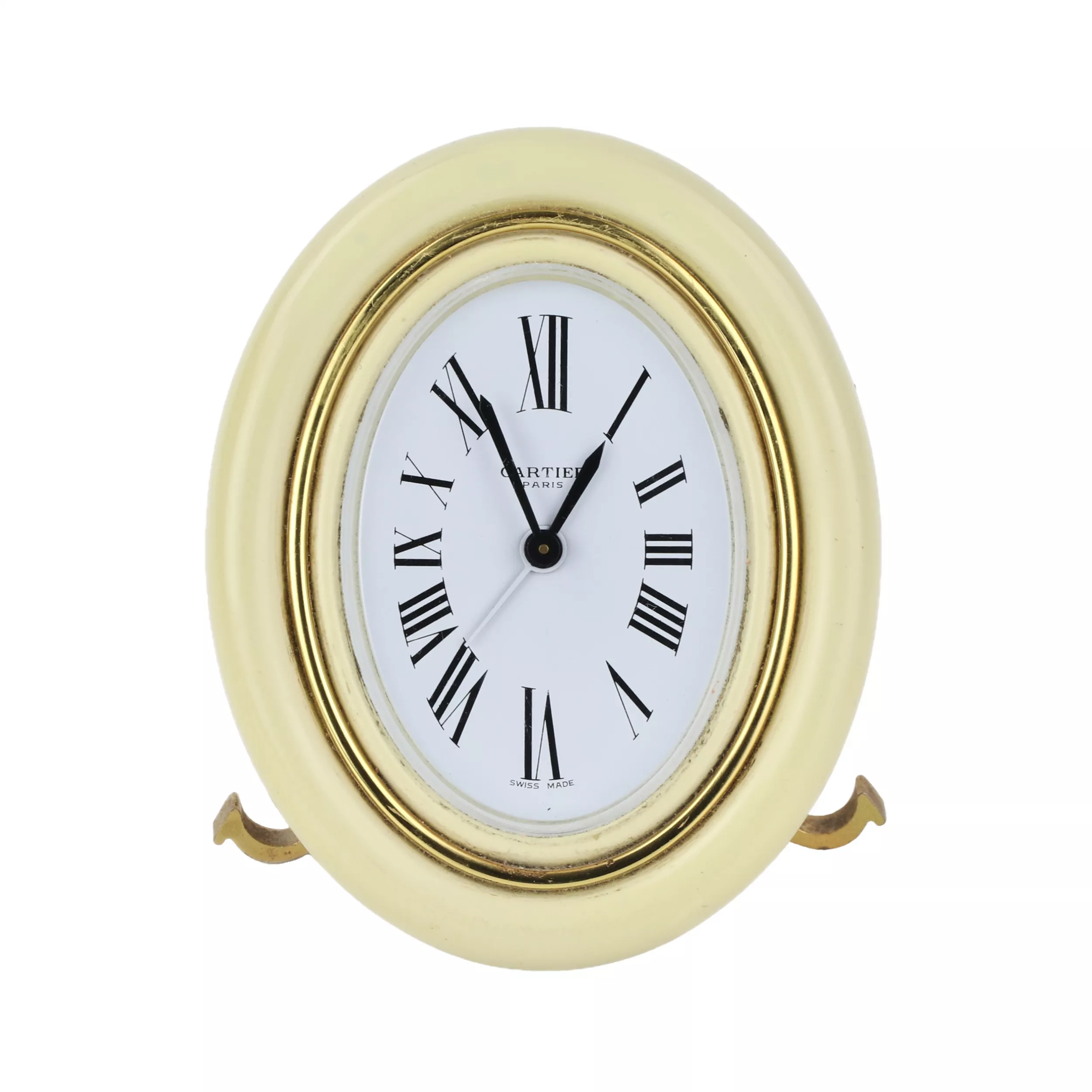 CARTIER. Reveil de voyage en metal dore avec email. 