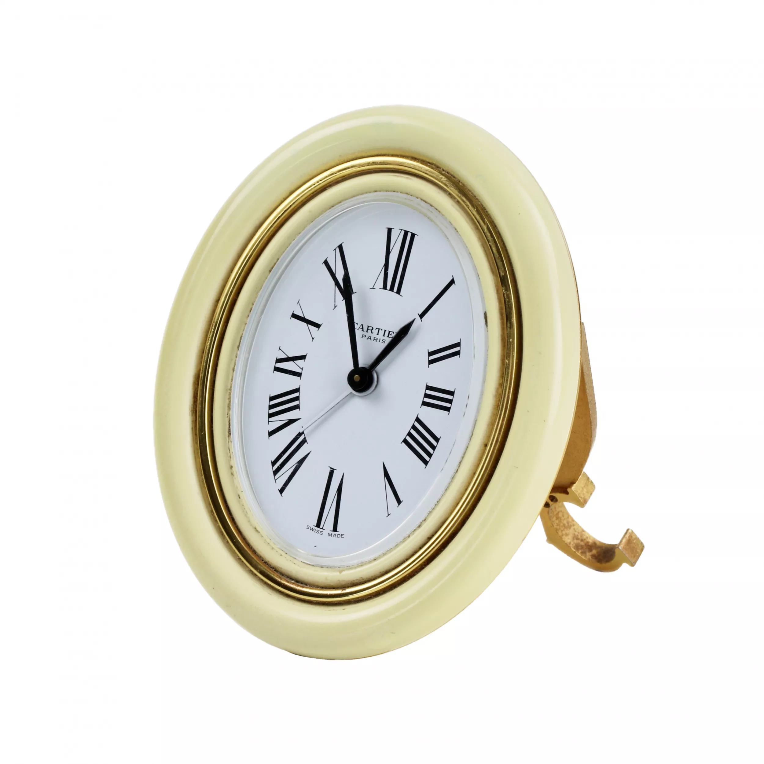 CARTIER. Reveil de voyage en metal dore avec email. 