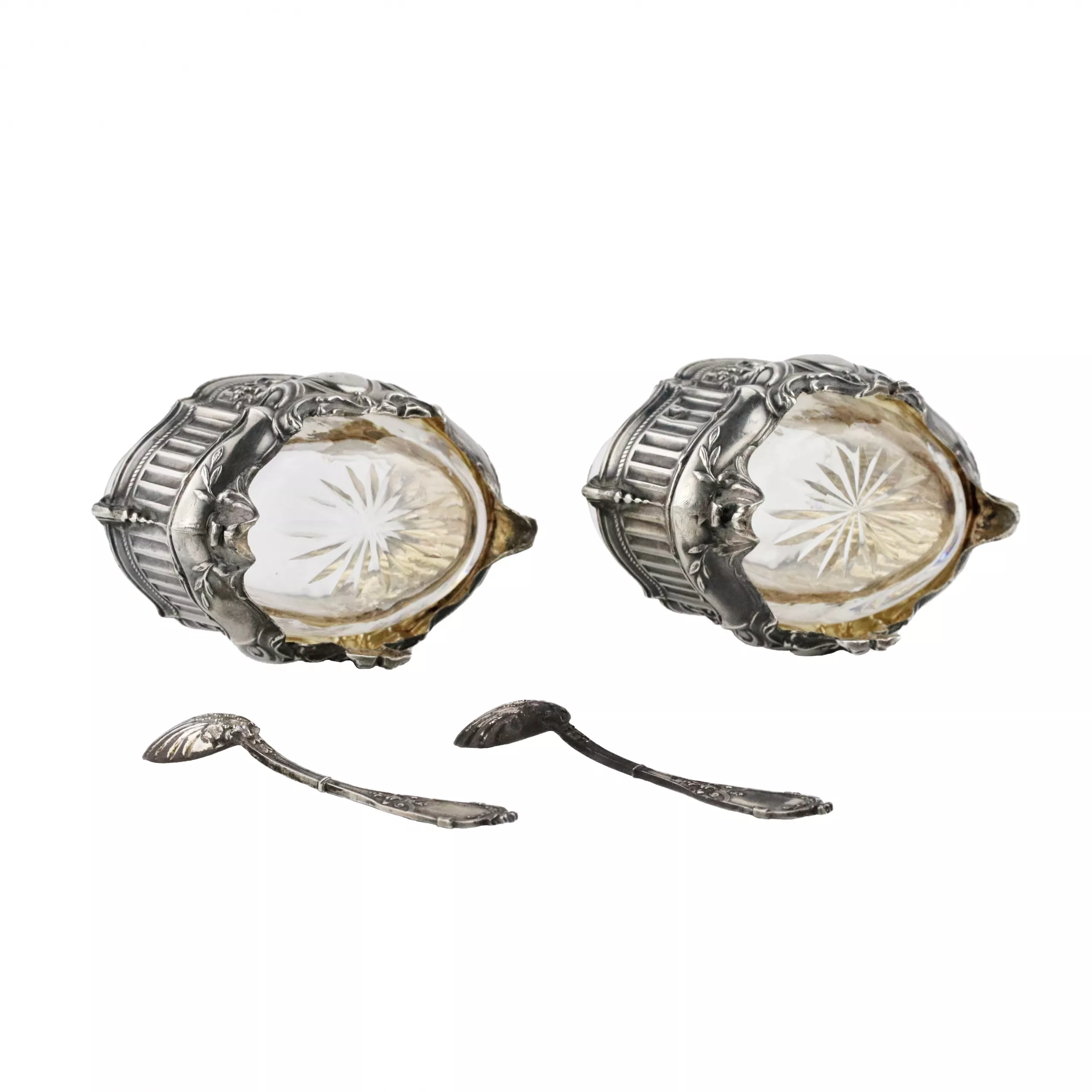 Pair of Louis XV style silver salt shakers. With spoons and original case. 