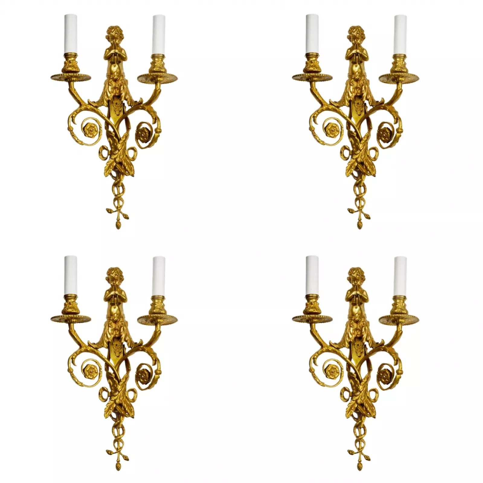 Four intricate gilded sconces with currency curls crowned with cherubs. 