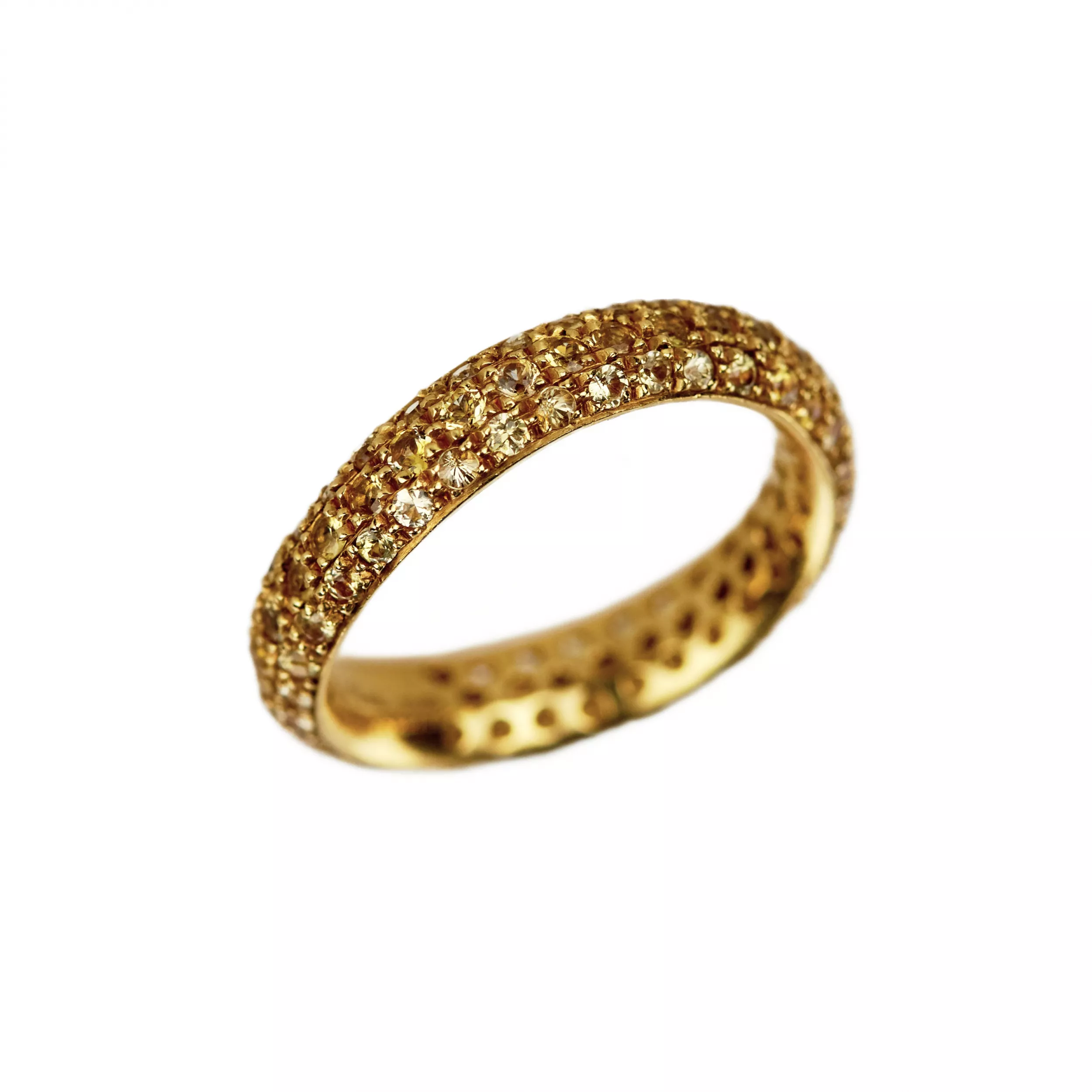 Bague en or jaune 18 K. Pomellato, avec anneau Wave en saphir jaune. 