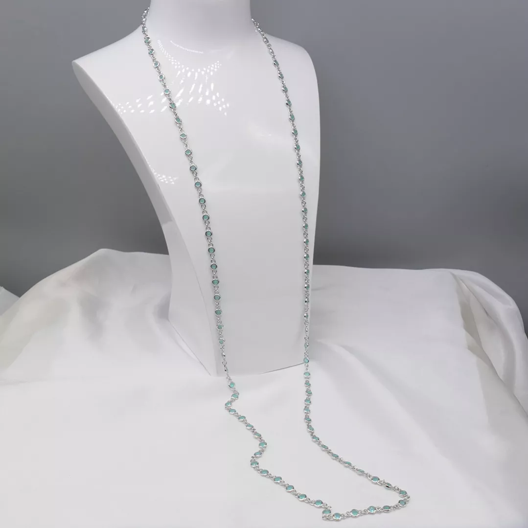 Delightful long necklace in sterling silver with turquoise blue stones. 