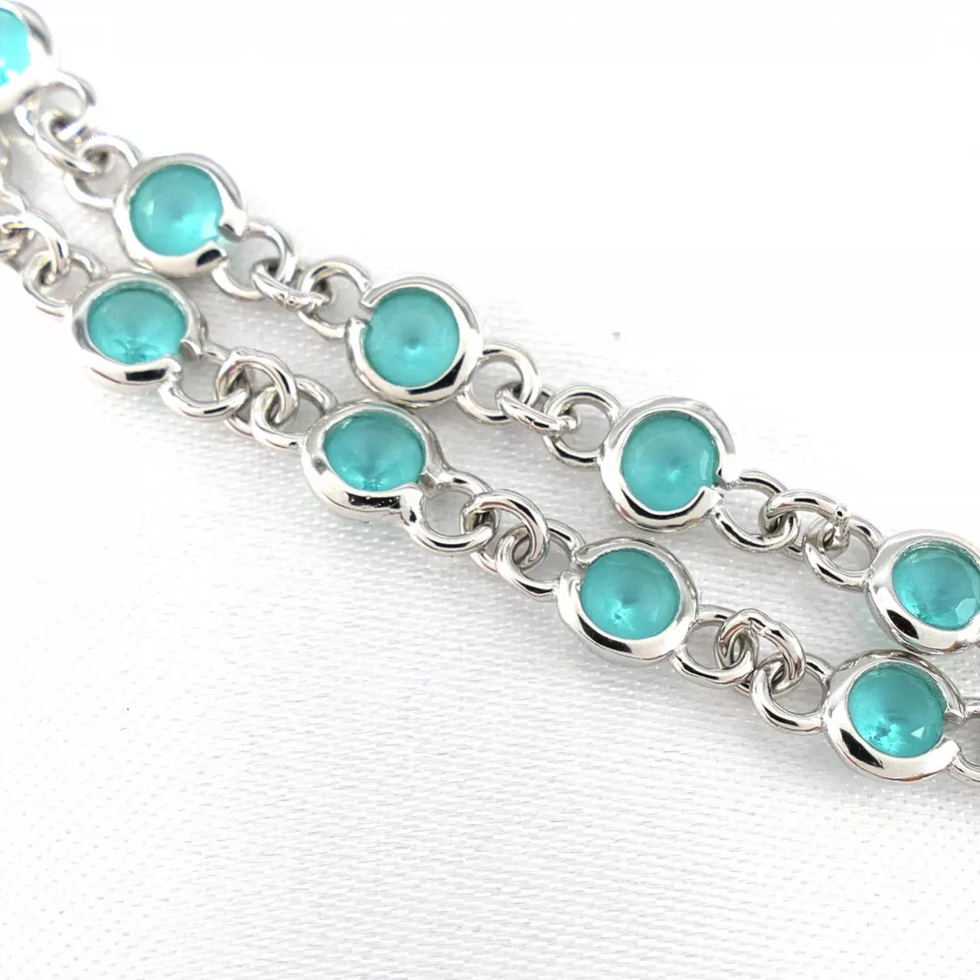 Delightful long necklace in sterling silver with turquoise blue stones. 