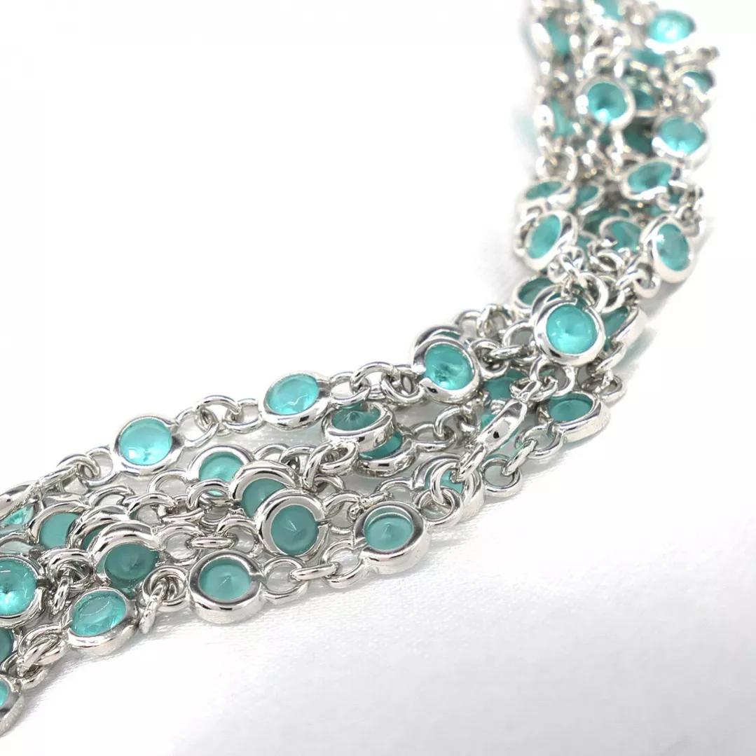 Delightful long necklace in sterling silver with turquoise blue stones. 