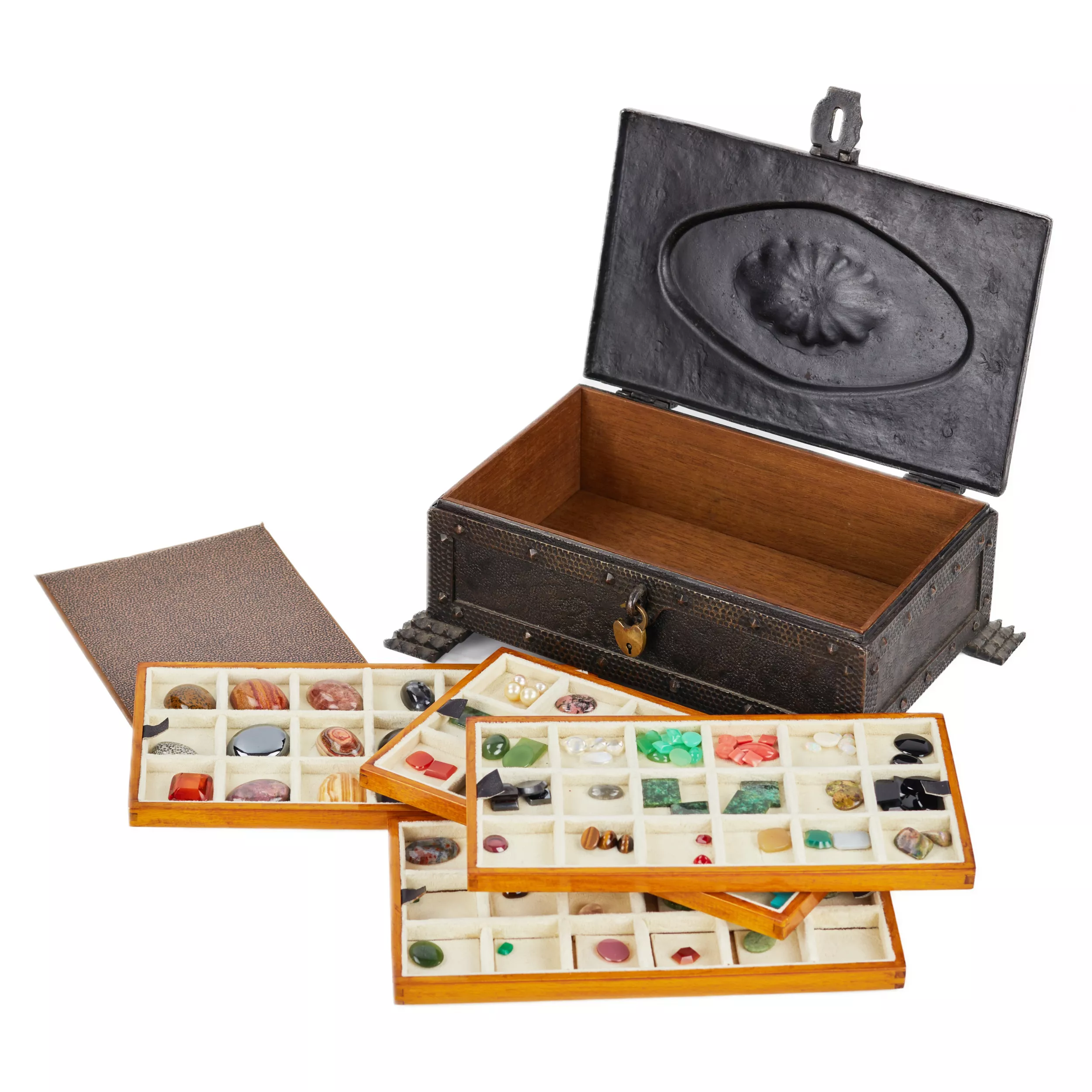 A large collection of semi-precious stones in a wrought-iron case