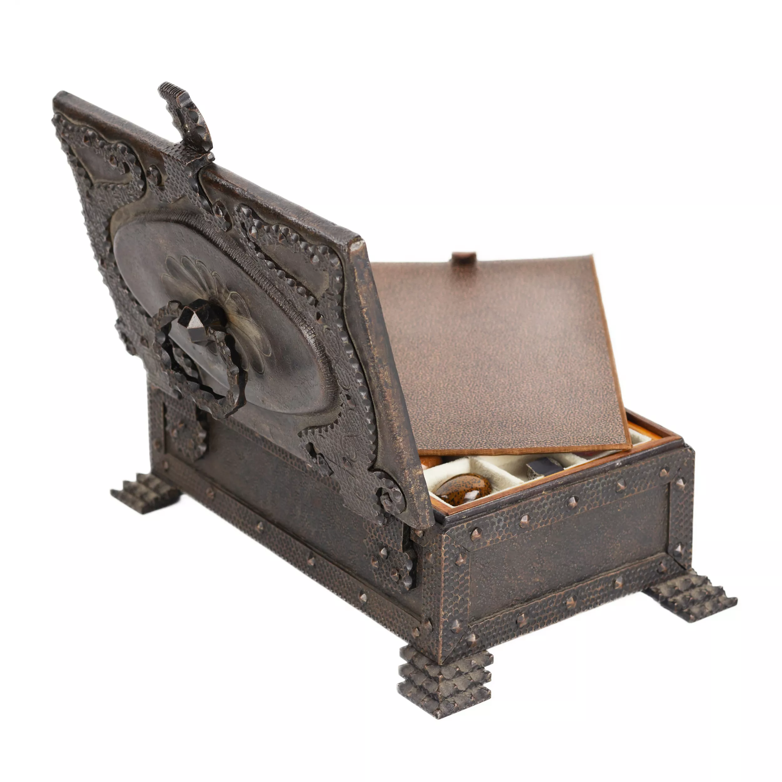 A large collection of semi-precious stones in a wrought-iron case