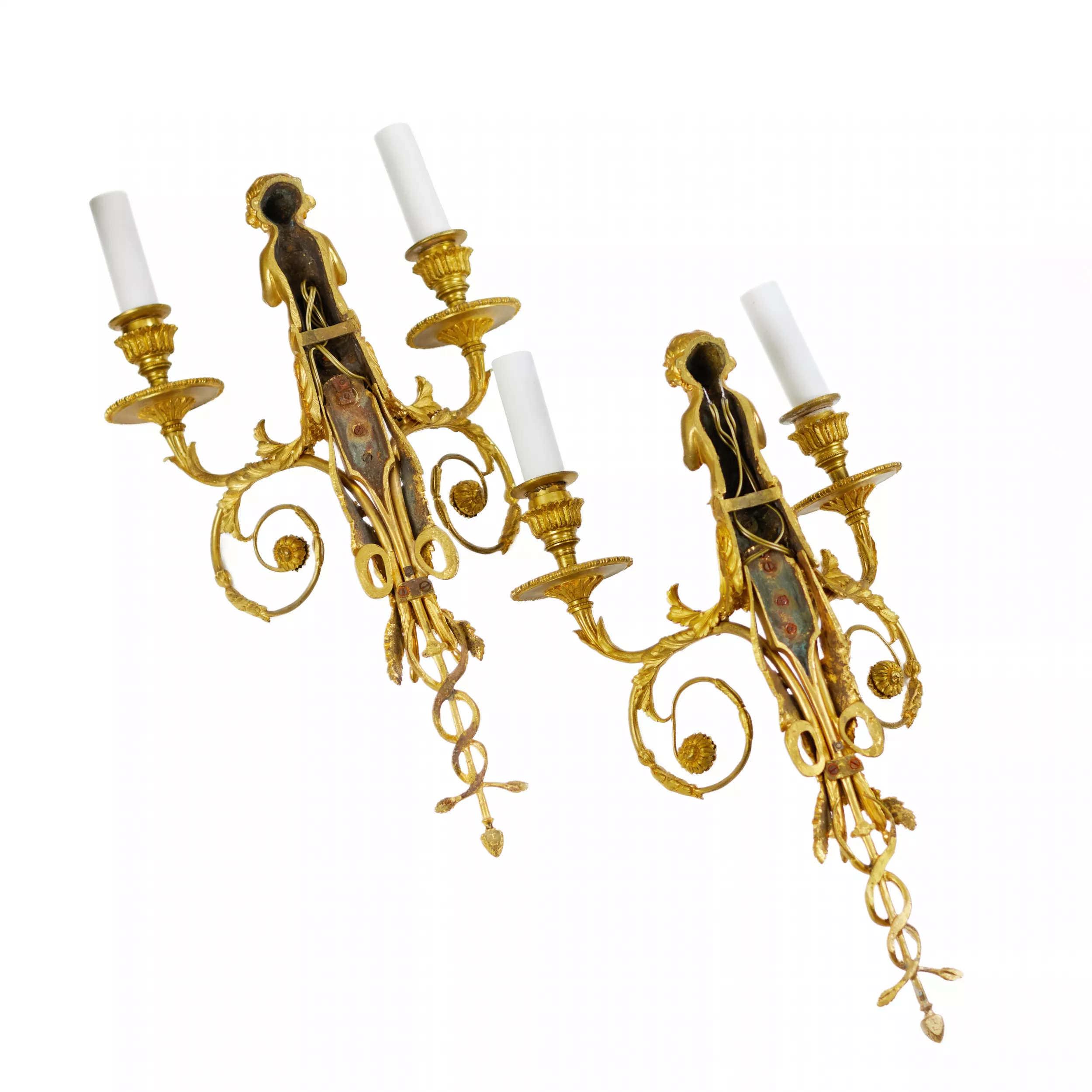 A PAIR OF FRENCH GILT-BRONZE TWO-LIGHT WALL APPLIQUES IN THE LOUIS XVI STYLE. AFTER A MODEL BY JEAN HAURÉ. FRANCE, SECOND HALF OF THE 19TH CENTURY