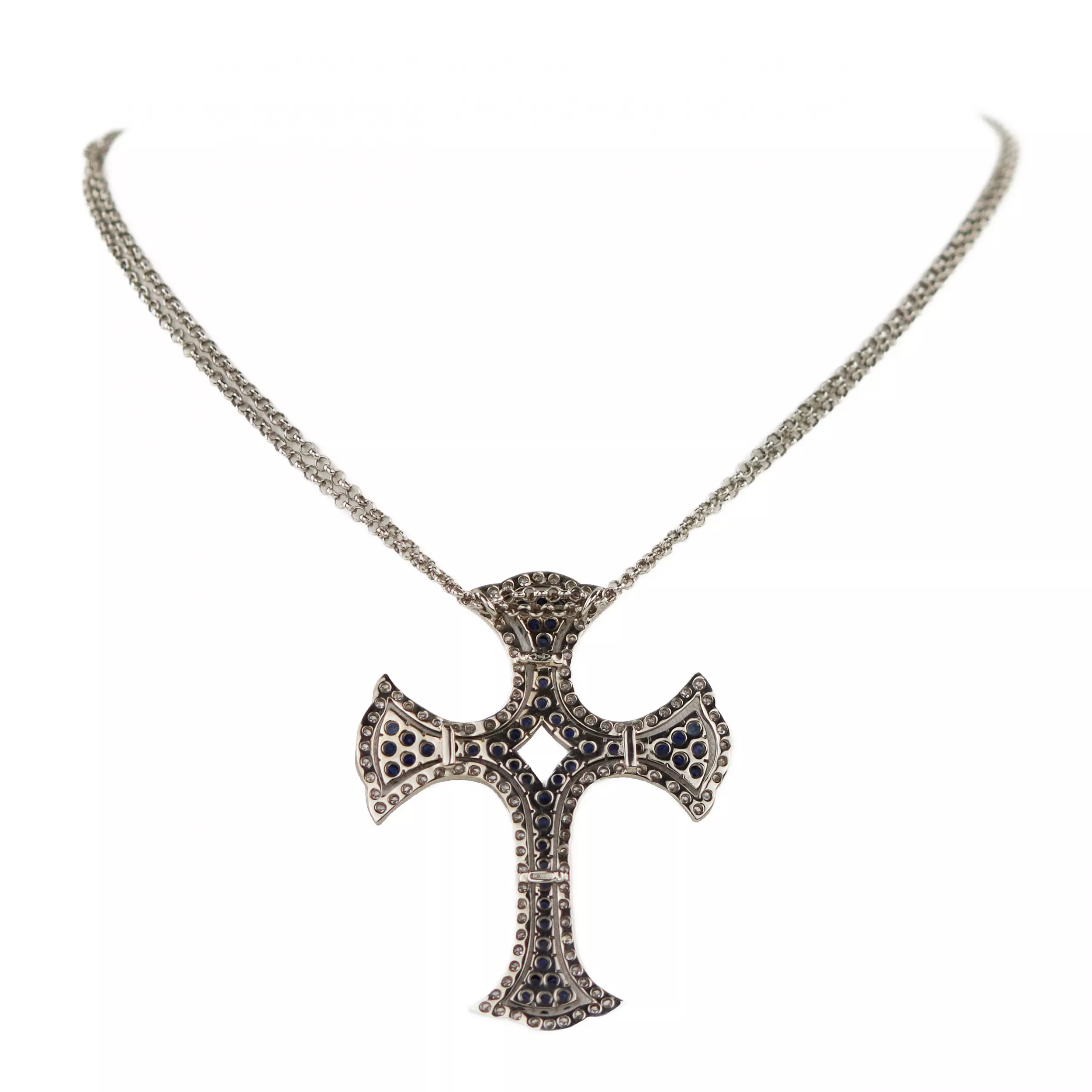  Croix en or blanc 18 carats, fabrication italienne, avec saphirs et diamants. 
