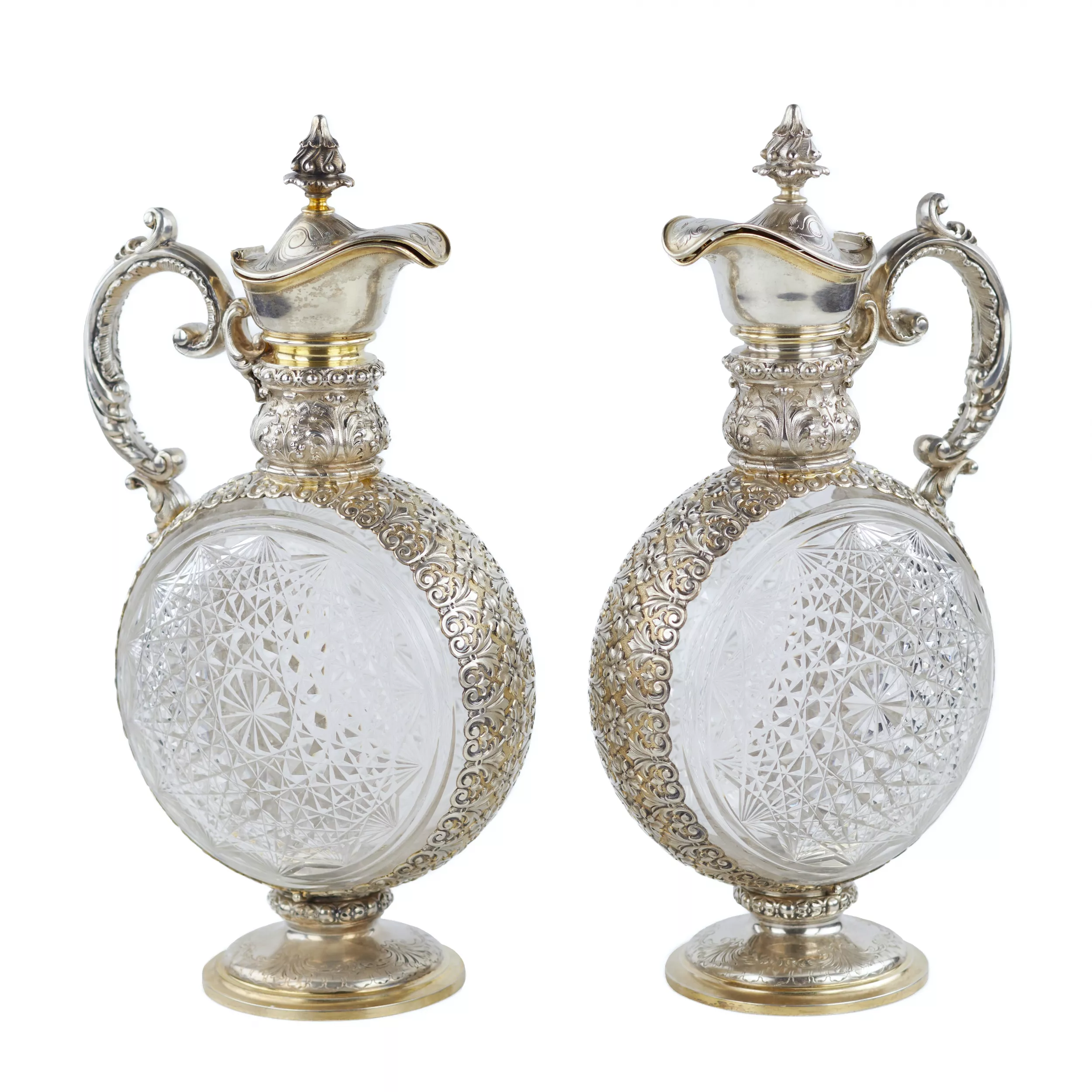 PAIR OF CUT CRYSTAL WINE EWERS WITH SILVER MOUNTS GERMANY, FIRST HALF OF THE 20TH CENTURY