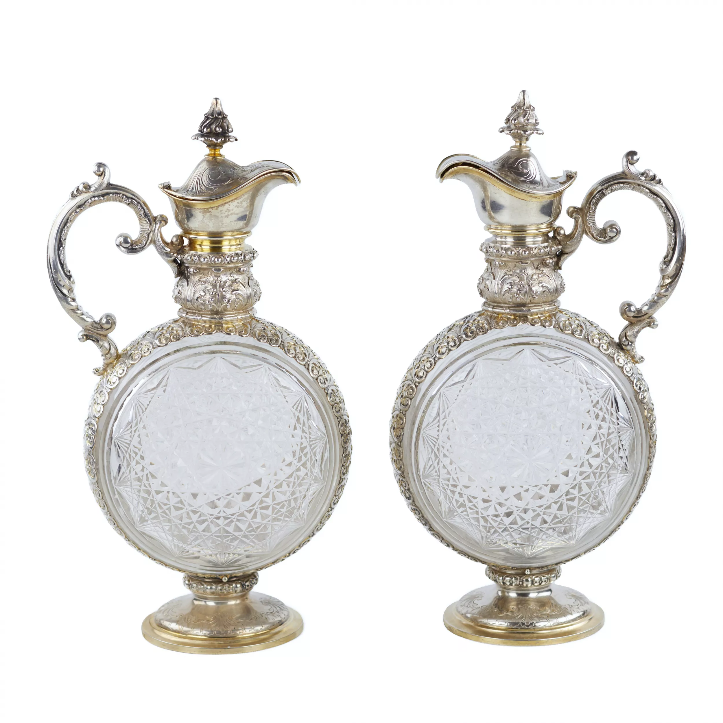 PAIR OF CUT CRYSTAL WINE EWERS WITH SILVER MOUNTS GERMANY, FIRST HALF OF THE 20TH CENTURY