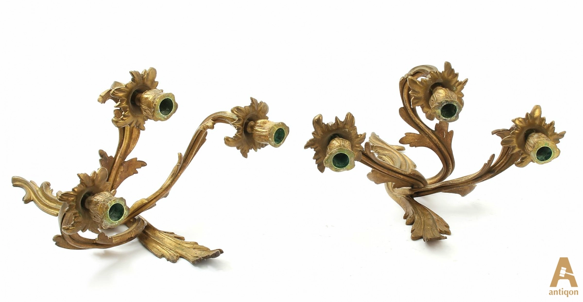A pair of gilt bronze sconces