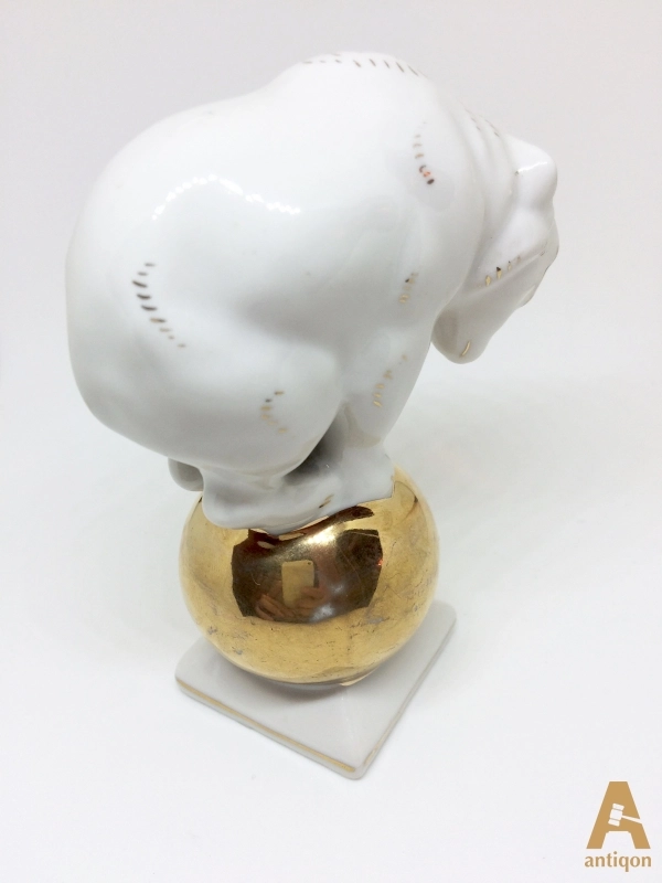 Polar bear on golden ball