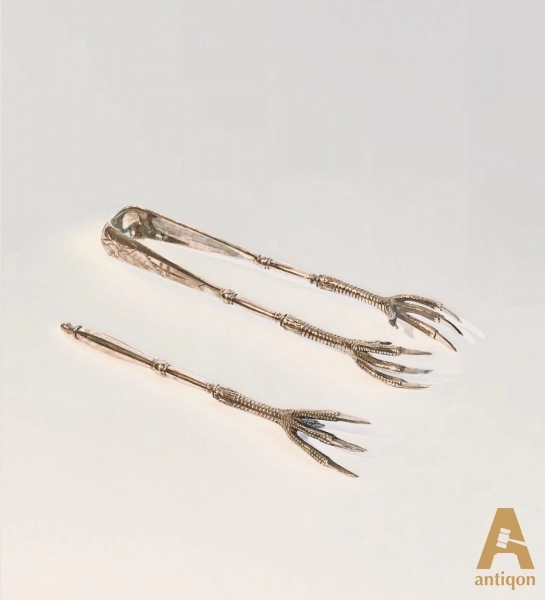 Ensemble de pinces à sucre en argent et une fourchette à citron. Russi