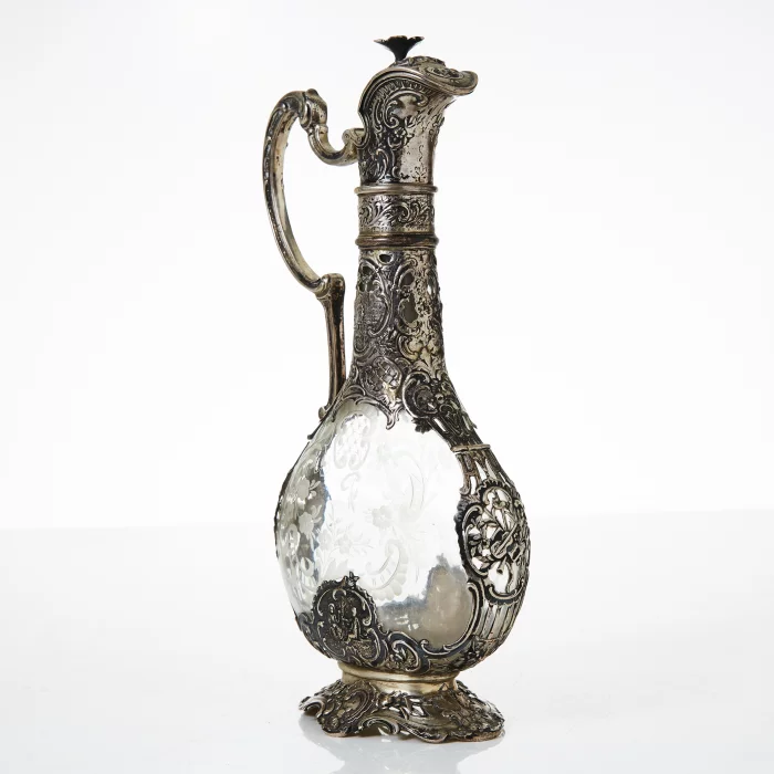 Silver decanter with glass.