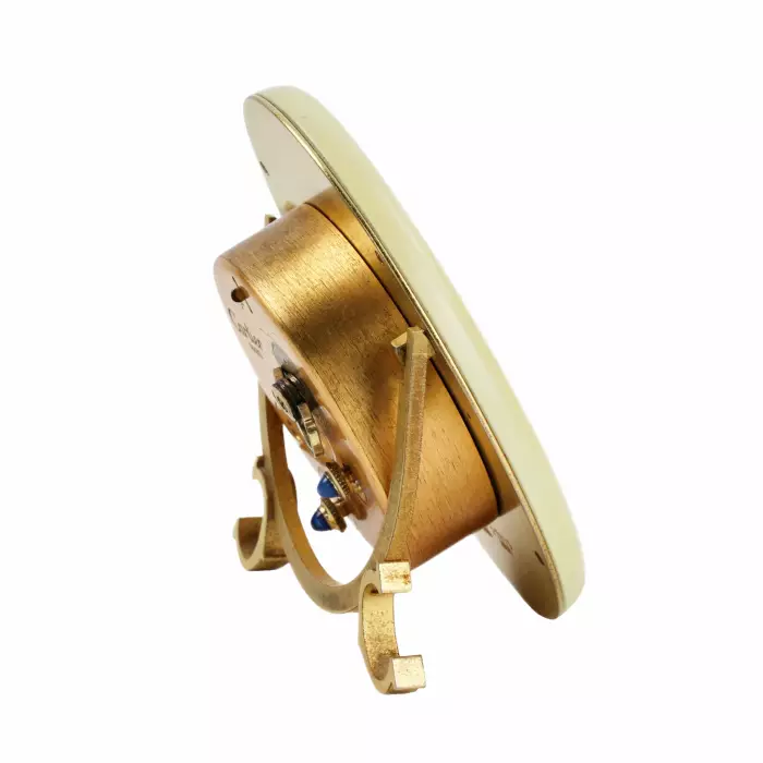 CARTIER. Reveil de voyage en metal dore avec email. 