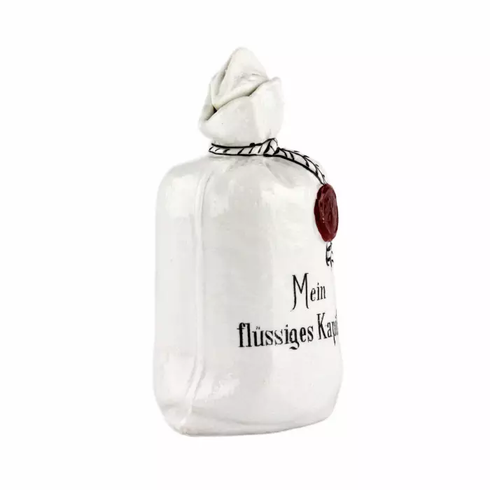 Porcelain bottle Mein flüssiges Kapital, in the shape of a canvas money bag. 