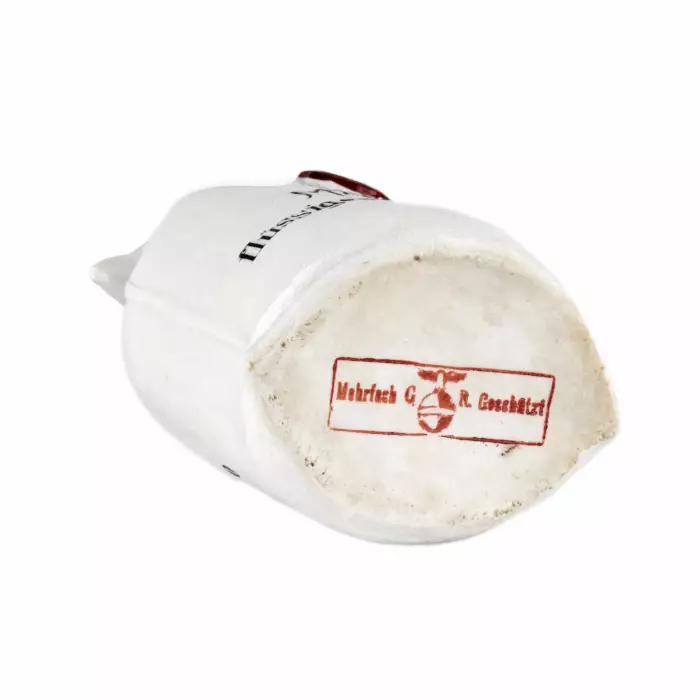Porcelain bottle Mein flüssiges Kapital, in the shape of a canvas money bag. 