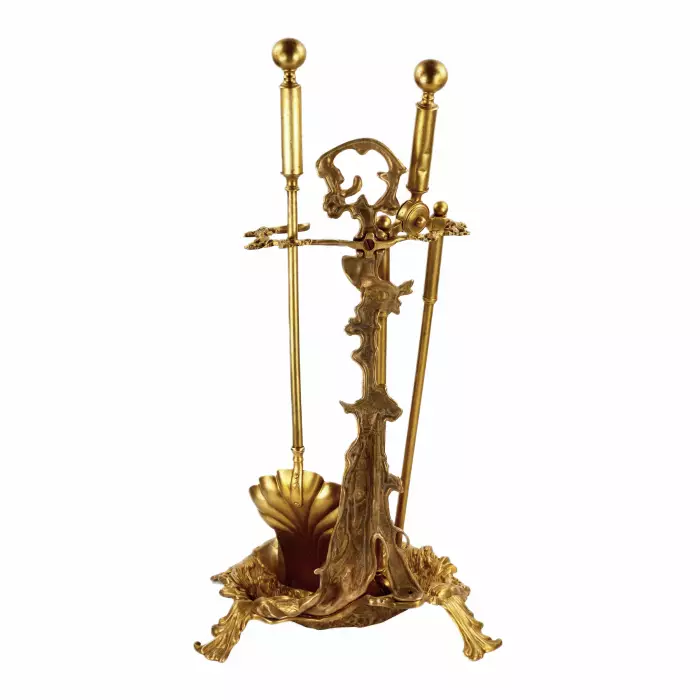 Brass set for a fireplace in the style of historicism. 19-20th centuries. 