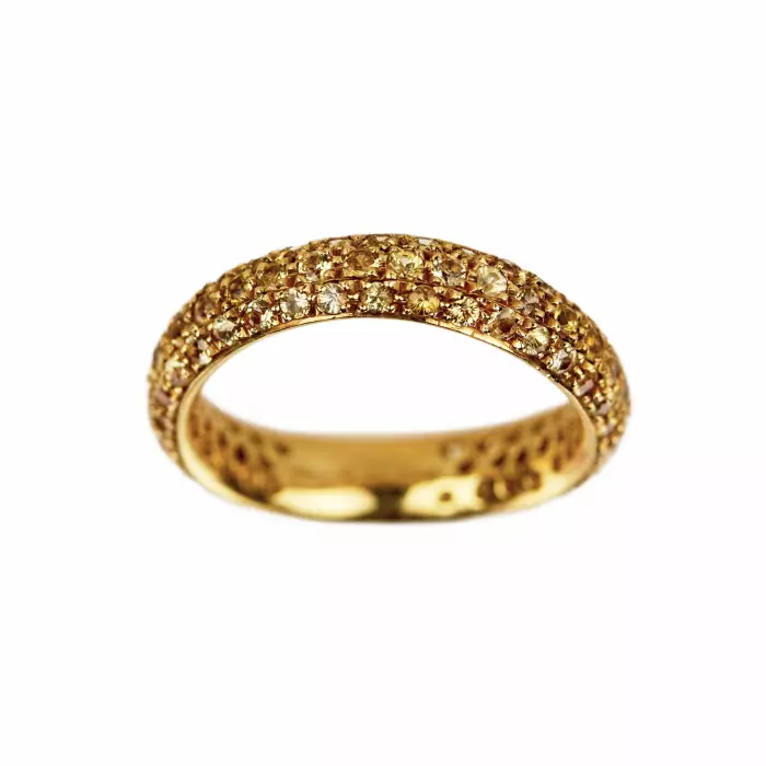Bague en or jaune 18 K. Pomellato, avec anneau Wave en saphir jaune. 