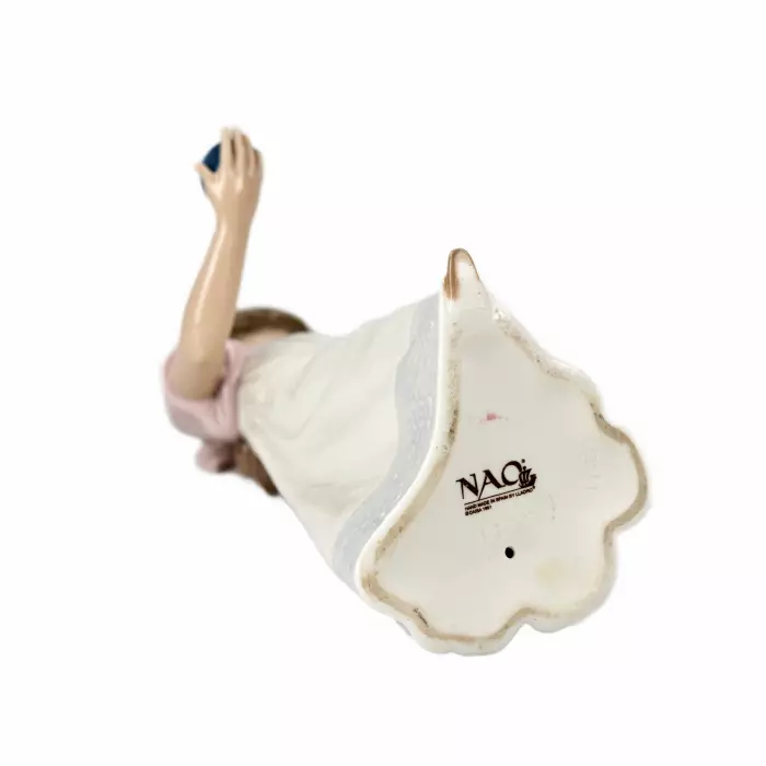 Cute figurine of a young lady with a burnt candle. Ladro, 1991 