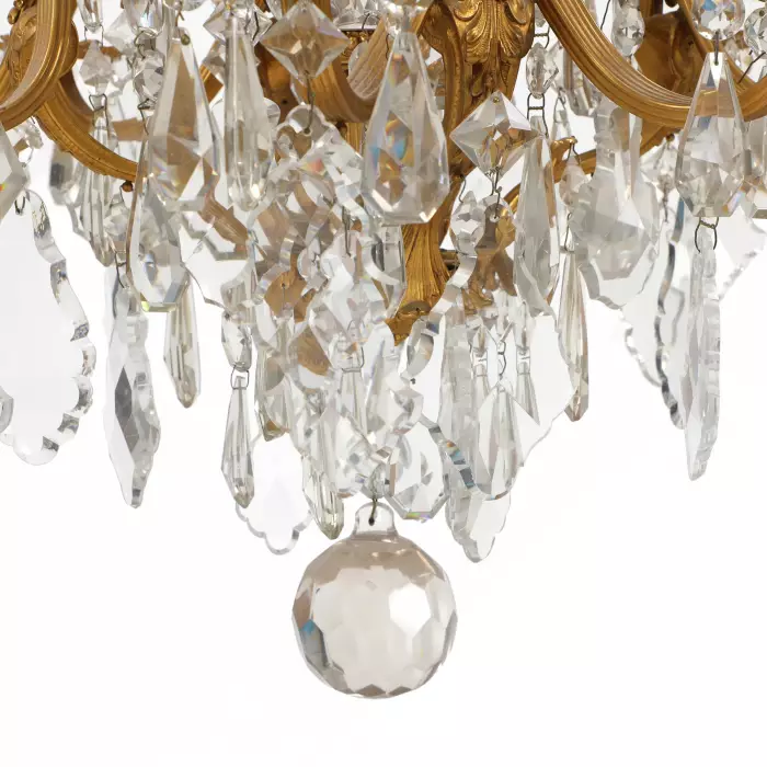 Chandelier in gilded bronze and crystal in neo-Rococo style with eight candles. France.1900 