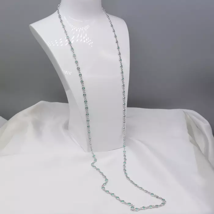 Delightful long necklace in sterling silver with turquoise blue stones. 