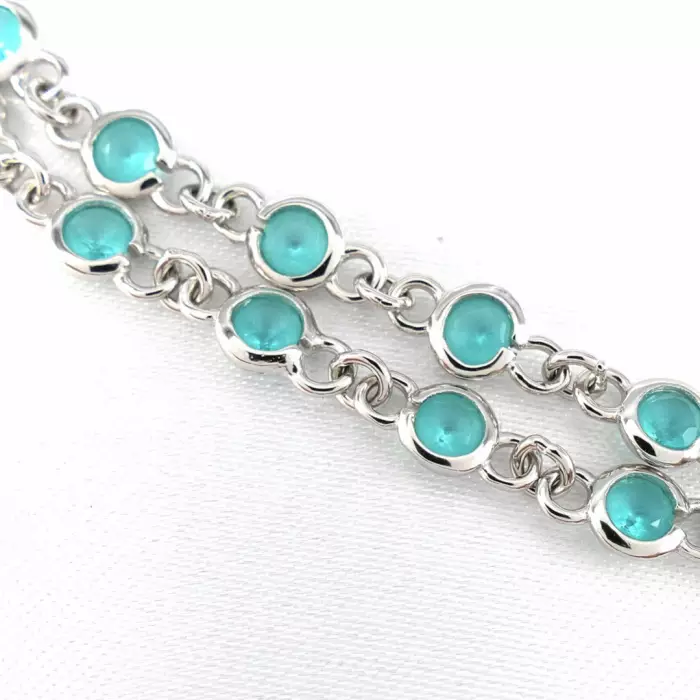 Delightful long necklace in sterling silver with turquoise blue stones. 