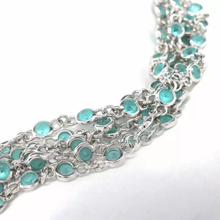 Delightful long necklace in sterling silver with turquoise blue stones. 