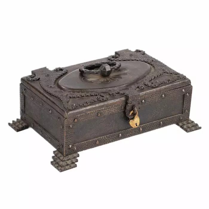 A large collection of semi-precious stones in a wrought-iron case