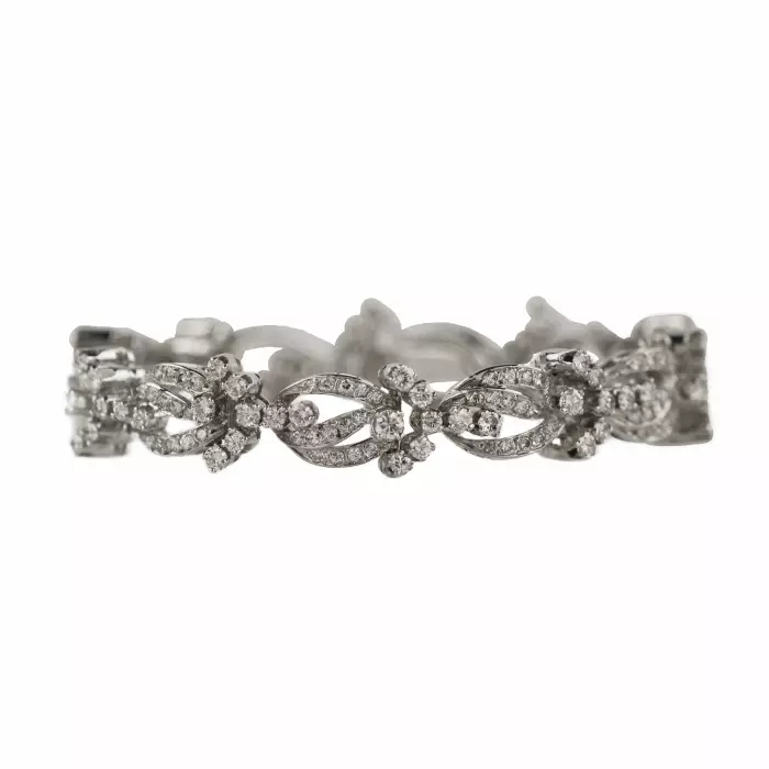 BRACELET IN 18 KARAT WHITE GOLD WITH DIAMOND FLORAL LINKS. 21ST CENTURY