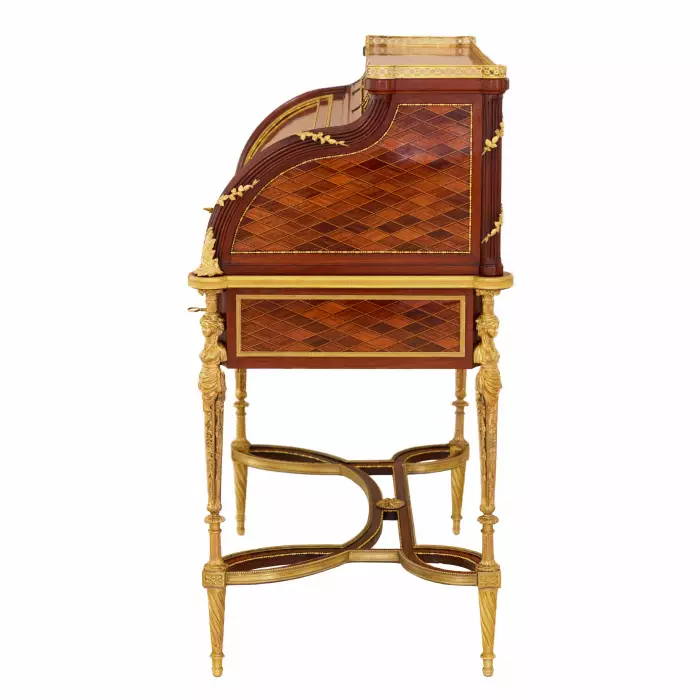 E.KAHN. Magnifique bureau cylindrique en acajou et bois satiné avec bronze doré. 
