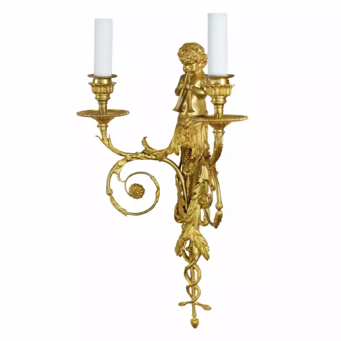 A PAIR OF FRENCH GILT-BRONZE TWO-LIGHT WALL APPLIQUES IN THE LOUIS XVI STYLE. AFTER A MODEL BY JEAN HAURÉ. FRANCE, SECOND HALF OF THE 19TH CENTURY