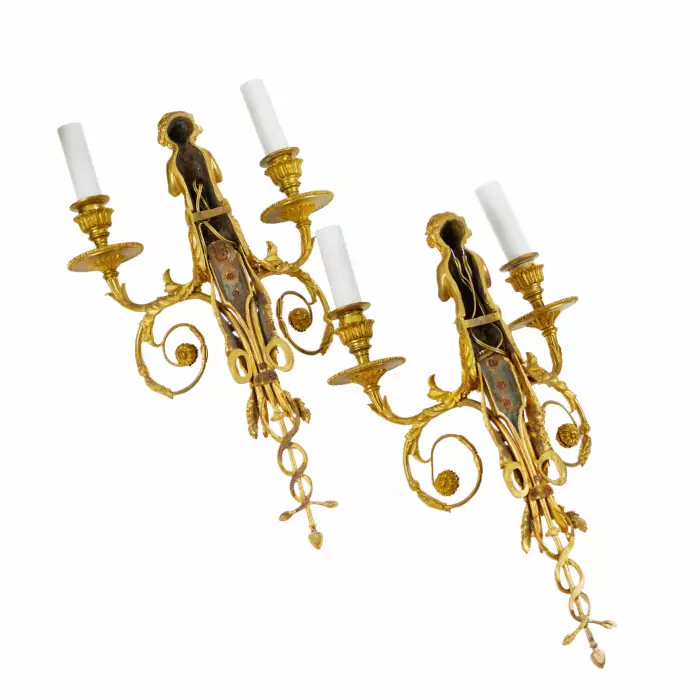 A PAIR OF FRENCH GILT-BRONZE TWO-LIGHT WALL APPLIQUES IN THE LOUIS XVI STYLE. AFTER A MODEL BY JEAN HAURÉ. FRANCE, SECOND HALF OF THE 19TH CENTURY