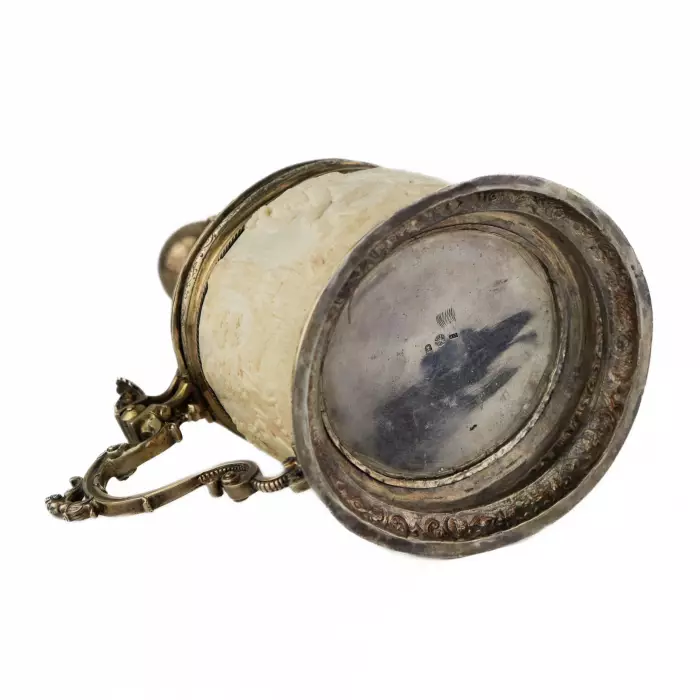 Silver beer goblet with Atlas on the lid and religious scenes on ivory. Lubeck. 17th century. 