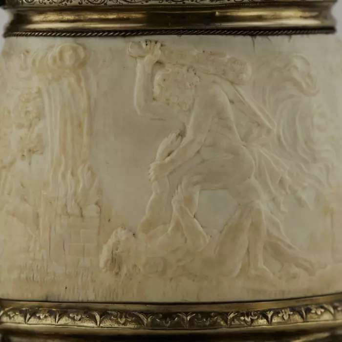 Silver beer goblet with Atlas on the lid and religious scenes on ivory. Lubeck. 17th century. 