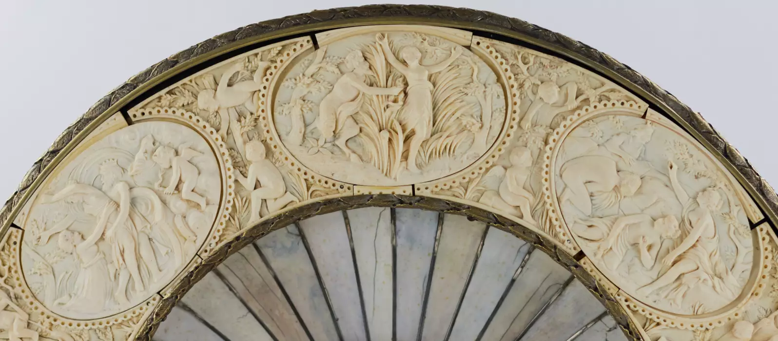 A magnificent neo-Renaissance Bacchus dish inlaid with ivory on wood in the manner of Johann Michael Maucher (1645-1701)