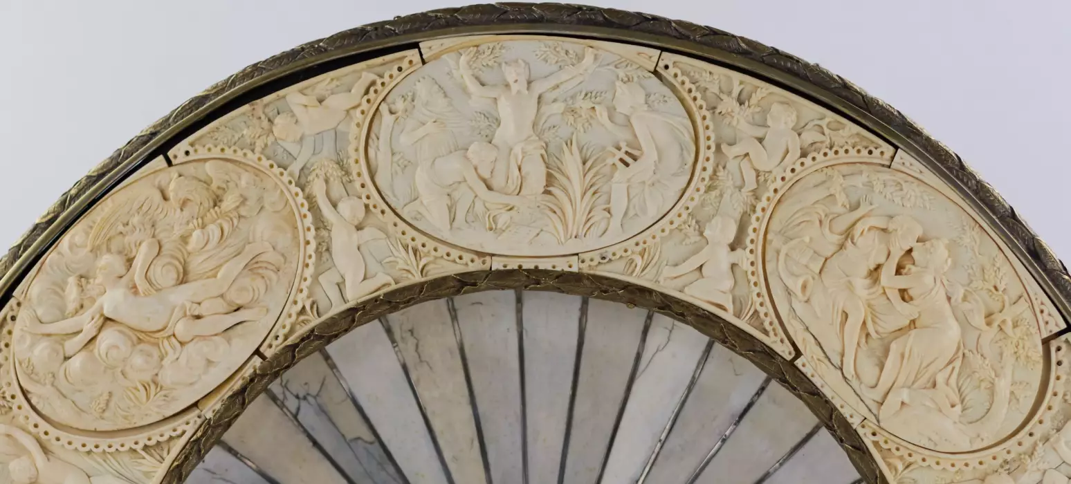 A magnificent neo-Renaissance Bacchus dish inlaid with ivory on wood in the manner of Johann Michael Maucher (1645-1701)