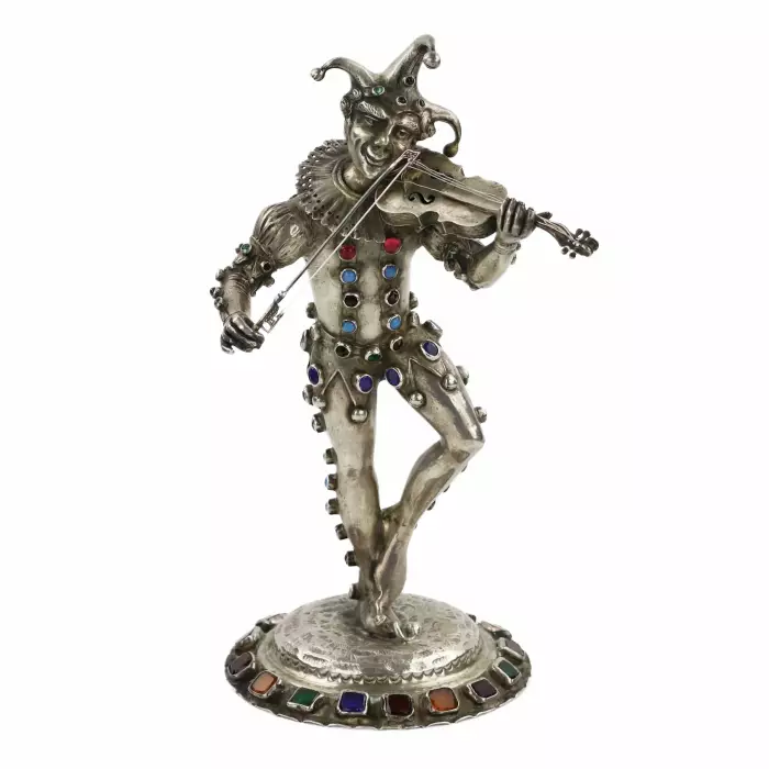 Figurine en argent d`un Arlequin jouant. Allemagne. 19ème siècle. 