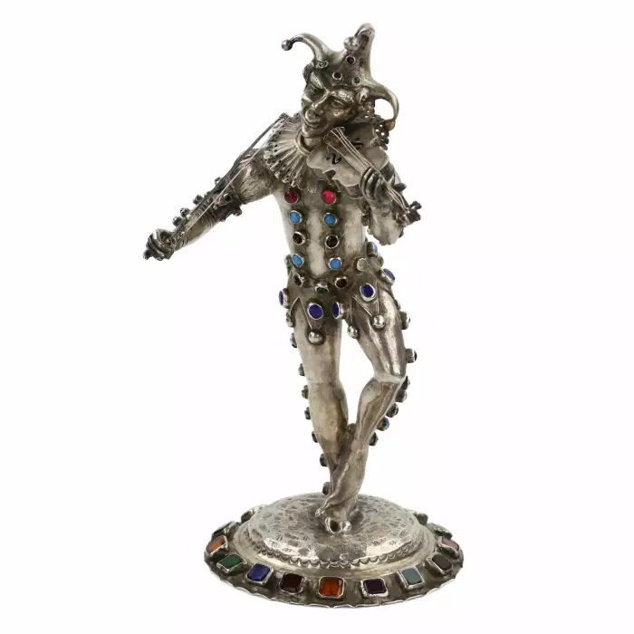 Figurine en argent d`un Arlequin jouant. Allemagne. 19ème siècle. 