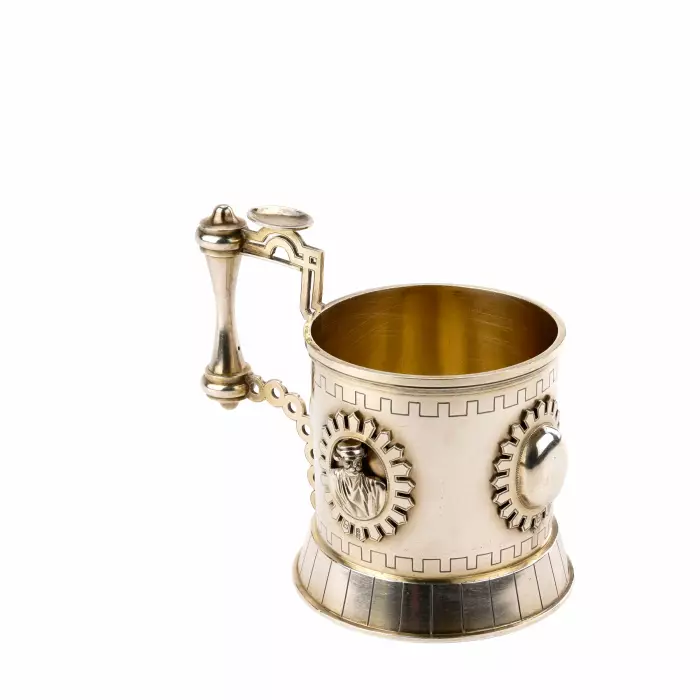 SILVER TEA GLASS HOLDER WITH RELIEF MEDALLIONS IN THE NEO-RUSSIAN STYLE. ST PETERSBURG, 1879