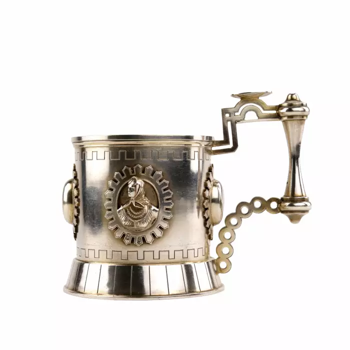 SILVER TEA GLASS HOLDER WITH RELIEF MEDALLIONS IN THE NEO-RUSSIAN STYLE. ST PETERSBURG, 1879