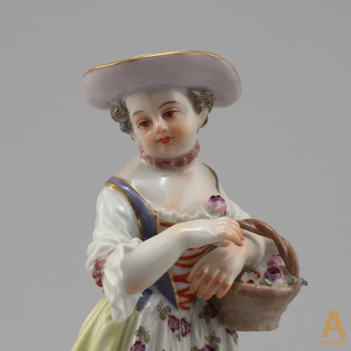 Girl with a basket of flowers. Meissen