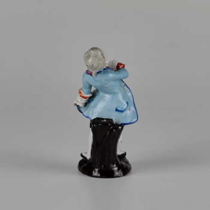 Porcelain figurine of a poet.