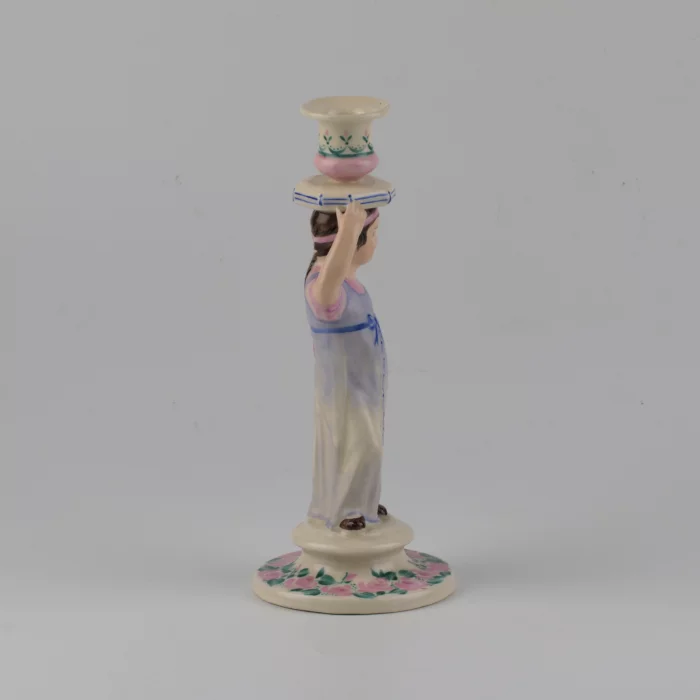 Porcelain candlestick-figure Russian peasant woman.